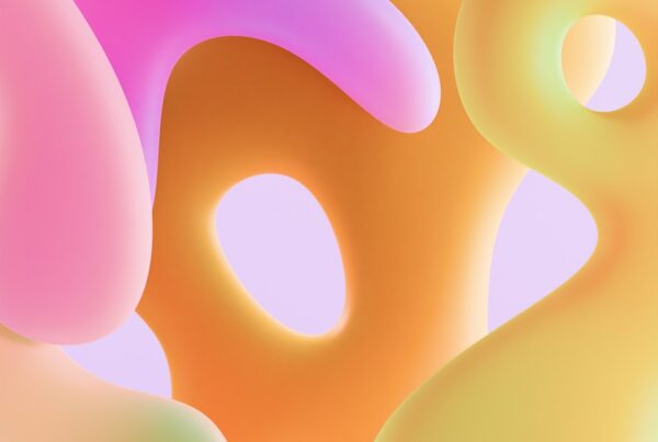 Abstract, colorful shapes float against a light background.
